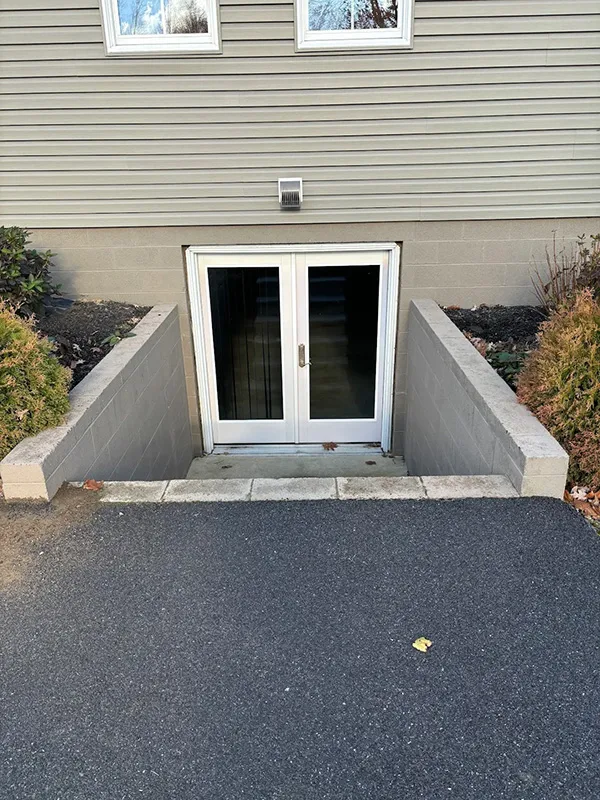 stairs descend to a basement door